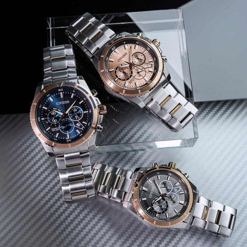 Citizen 44mm quartz chronograph watches featuring two-tone stainless steel bracelets and blue, rose gold, and black dials.