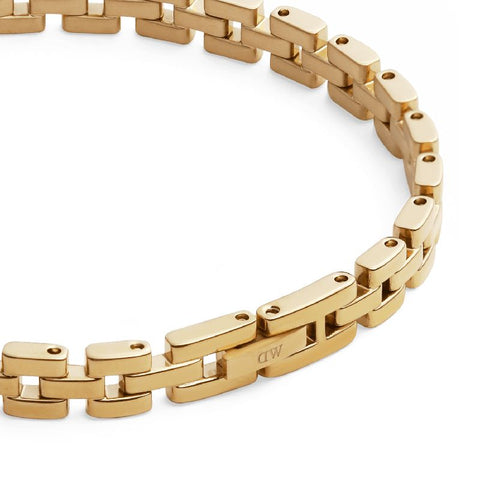 Daniel Wellington 3-link gold stainless steel bracelet with a polished PVD finish and elegant fold-over clasp.