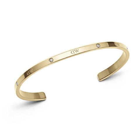 Adjustable gold stainless steel Classic Lumine cuff bangle featuring six sparkling crystals and engraved DW branding.