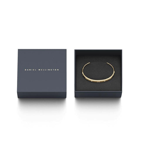 Gold Daniel Wellington Classic Lumine cuff bangle featuring six sparkling crystals in a branded gift box.