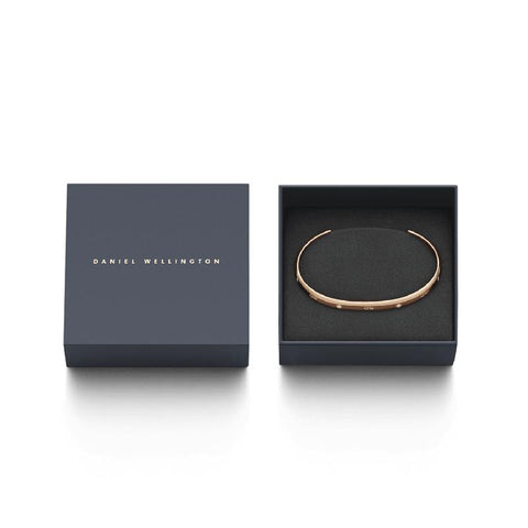 Daniel Wellington Classic Lumine rose gold stainless steel cuff bracelet with six crystals in a branded gift box.