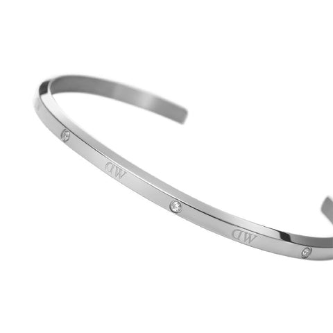 Adjustable silver stainless steel Daniel Wellington Classic Lumine cuff bracelet featuring six sparkling crystal accents.