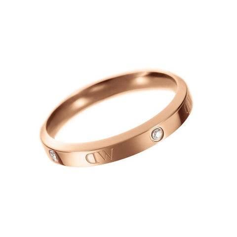 Daniel Wellington Classic Lumine rose gold ring featuring sparkling crystal stones and elegant logotype etchings.