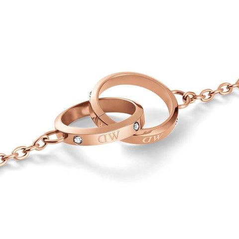 Daniel Wellington Classic Lumine Unity bracelet in rose gold stainless steel with intertwined crystal-accented rings.