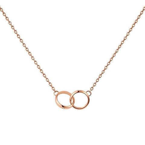Daniel Wellington Classic Lumine Unity necklace in rose gold stainless steel with two interlocking crystal-set rings.