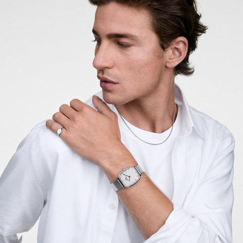 Minimalist Daniel Wellington Classic Signet Ring in polished 316L stainless steel worn on a finger.