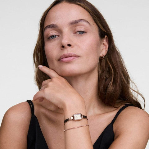 Radiant rose gold Daniel Wellington tennis bracelet featuring shimmering crystals on a durable stainless steel chain.