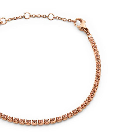 Daniel Wellington rose gold tennis bracelet featuring shimmering apricot crystals and an adjustable stainless steel chain.
