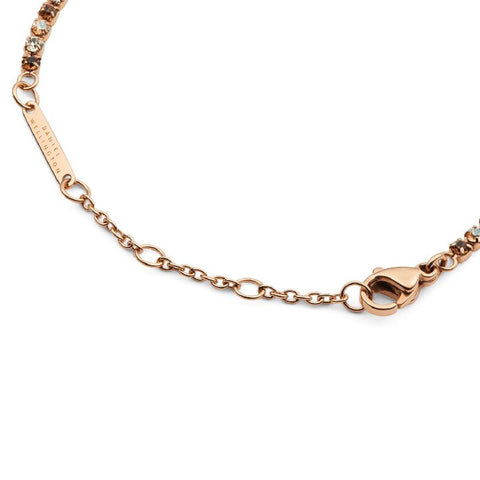 Rose gold Daniel Wellington tennis bracelet featuring shimmering honey crystals, adjustable sizing rings, and a secure lobster clasp.