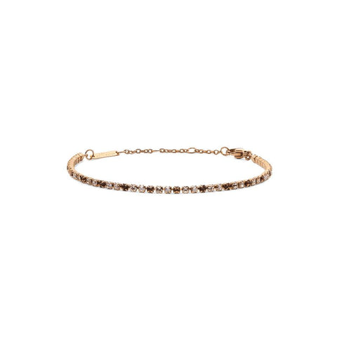 Rose gold Daniel Wellington tennis bracelet featuring shimmering honey-toned crystals and an adjustable stainless steel chain.