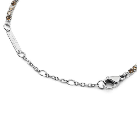 Daniel Wellington silver tennis bracelet with honey crystals, stainless steel chain, and adjustable lobster clasp closure.