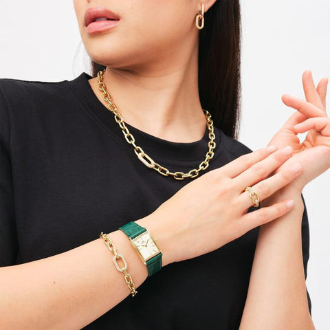 Daniel Wellington gold crystal link bracelet featuring a polished stainless steel chain with a sparkling claw-set crystal ring.