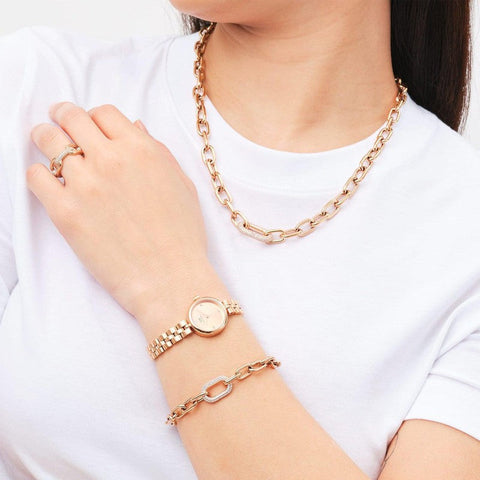 Elegant rose gold Daniel Wellington crystal link bracelet paired with a matching watch, necklace, and ring set.