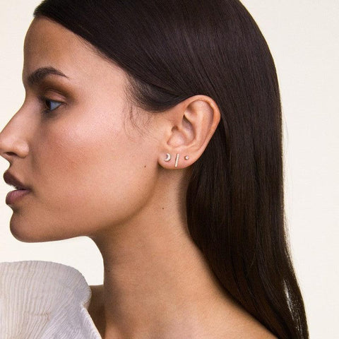 Daniel Wellington Crystal Moon gold stud earrings in stainless steel with a delicate 5mm claw-set stone design.