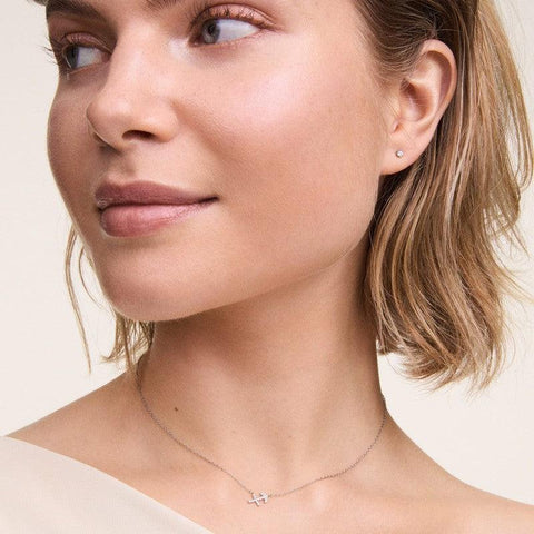 Elegant Daniel Wellington rose gold crystal stud earrings in stainless steel with a delicate 2.5mm claw-set design.