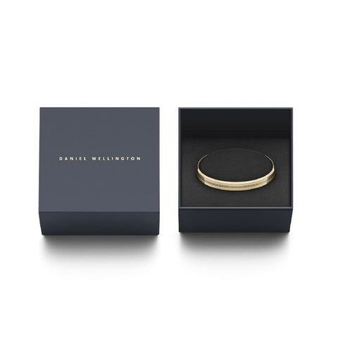 Daniel Wellington Elan gold-plated stainless steel bracelet, 7mm wide, presented in a sleek branded gift box.