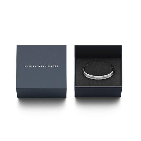 Elegant silver stainless steel Daniel Wellington Elan cuff bangle displayed in a premium branded gift box.