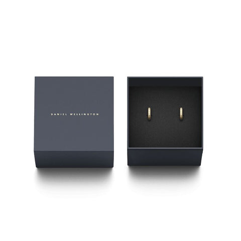 Minimalist gold-plated Daniel Wellington Elan hoop earrings with engraved logo, presented in a sleek branded gift box.