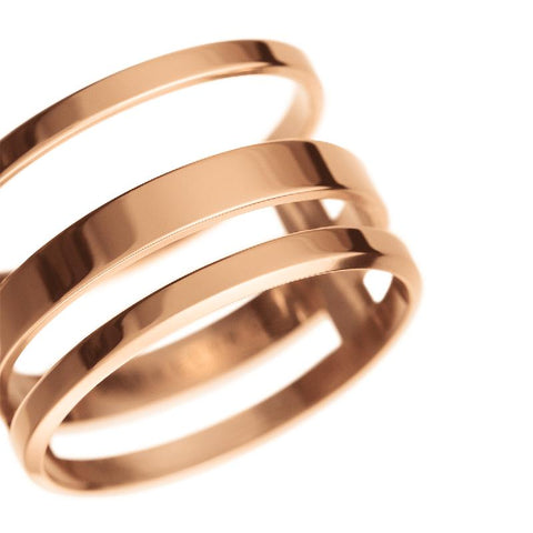 Elegant Daniel Wellington Elan Triad ring in polished rose gold-plated stainless steel with a triple-band design.