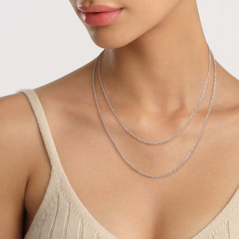 Elegant silver Daniel Wellington Elan twisted chain necklace crafted from durable stainless steel worn around the neck.