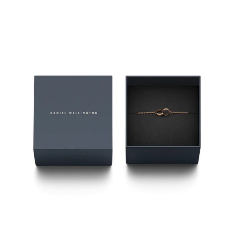 Daniel Wellington Elan Unity bracelet in rose-plated stainless steel, featuring interlocking rings in a branded gift box.