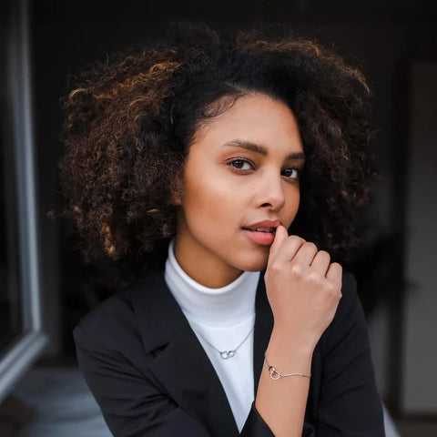 Elegant silver Daniel Wellington Elan Unity bracelet in stainless steel worn on a woman's wrist as a delicate everyday piece.