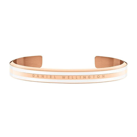 Daniel Wellington Emalie Slim rose gold stainless steel cuff bangle with white enamel inlay and engraved logo.