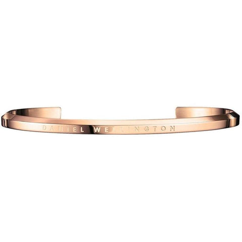 Large Daniel Wellington rose gold plated stainless steel cuff bangle with engraved logo branding.