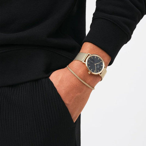 Elegant gold 2.8mm mesh bracelet in PVD plated stainless steel, styled alongside a matching Daniel Wellington watch.