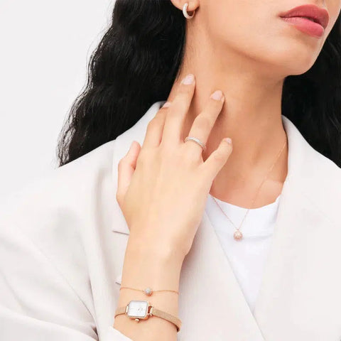Rose gold Daniel Wellington Pavé crystal hoop earrings featuring a sparkling claw-set design and secure hinge lock.