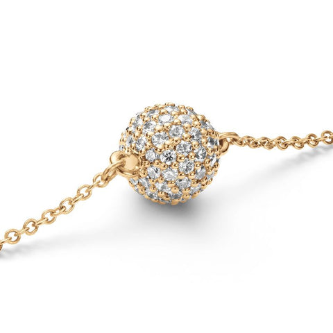 Daniel Wellington gold pavé crystal pendant bracelet featuring a sparkling, claw-set CZ crystal sphere on a delicate chain.