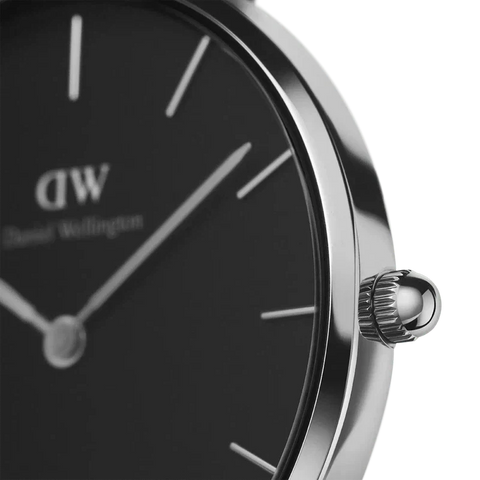 Daniel Wellington Petite Ashfield 28mm watch featuring a sleek black dial and polished silver stainless steel case.