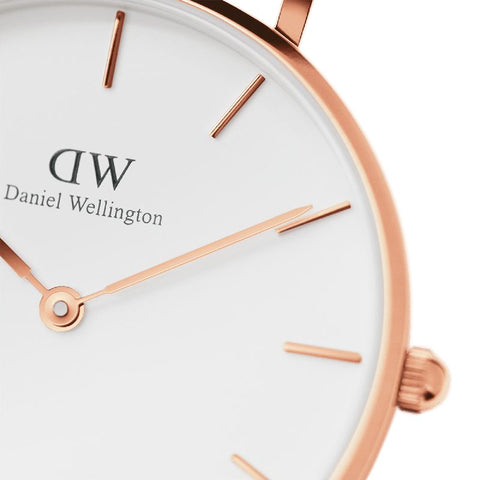 Daniel Wellington Petite Melrose 24mm watch featuring an elegant eggshell white dial and polished rose gold case.