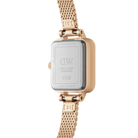 Back view of the rose gold Daniel Wellington Quadro Mini watch with a delicate stainless steel mesh bracelet.