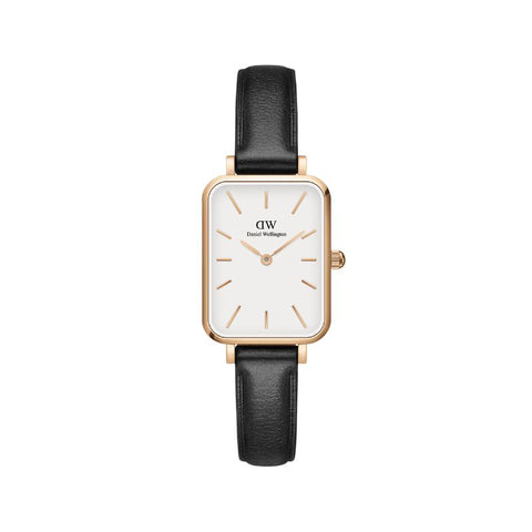 Daniel Wellington Quadro watch with a rose gold square case, eggshell white dial, and black leather strap.