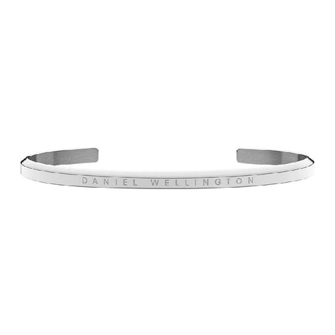 Small Daniel Wellington silver stainless steel cuff bangle with minimalist engraved branding.