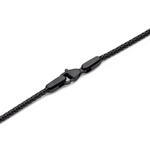 Daniel Wellington Tide black stainless steel mesh necklace featuring a secure lobster clasp and engraved logo detail.