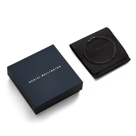 Daniel Wellington Tide black stainless steel mesh necklace with lobster clasp, presented in a branded gift box and pouch.