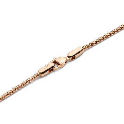 Rose gold stainless steel mesh necklace featuring a secure lobster clasp with Daniel Wellington branding.