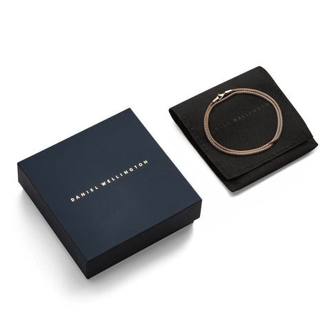 Daniel Wellington Tide rose gold mesh necklace with lobster clasp, displayed in a branded gift box and black pouch.