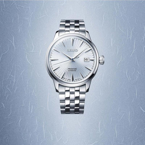 Seiko Presage Sky Diving automatic watch with a sunray light blue dial, stainless steel case, and matching link bracelet.
