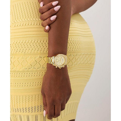 The Watch Boutique Guess Ladies Victoria Gold Tone Multi-Function Watch with Diamond-Studded Face