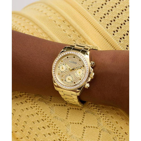 The Watch Boutique Guess Ladies Victoria Gold Tone Multi-Function Watch with Diamond-Studded Face
