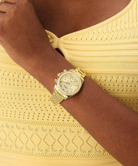 The Watch Boutique Guess Ladies Victoria Gold Tone Multi-Function Watch with Diamond-Studded Face