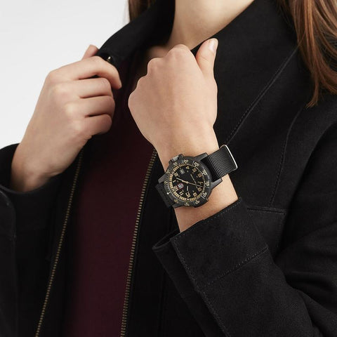 Luminox Leatherback SEA Turtle Giant watch with orange dial, black CARBONOX case, and durable black webbing strap.