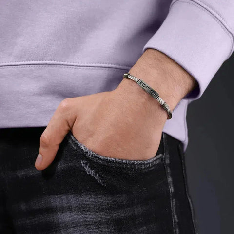 Police Pe Quadro men's grey cable bracelet, 190mm, featuring a stylish engraved metal bar design on a wrist.